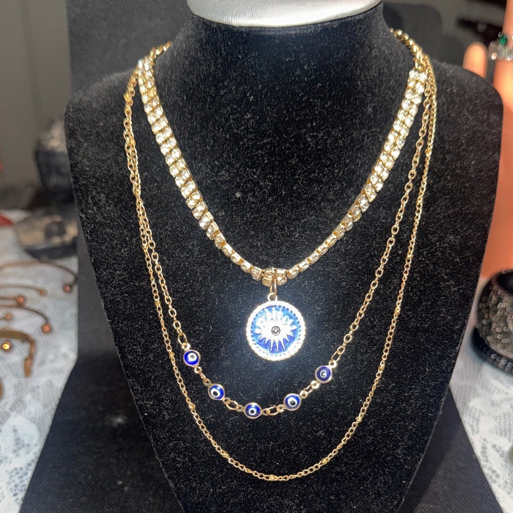 Elegant Gold Layered Necklace with Evil Eye Pendant